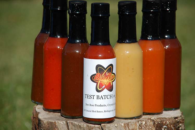 unlabeled bottles of hot sauce